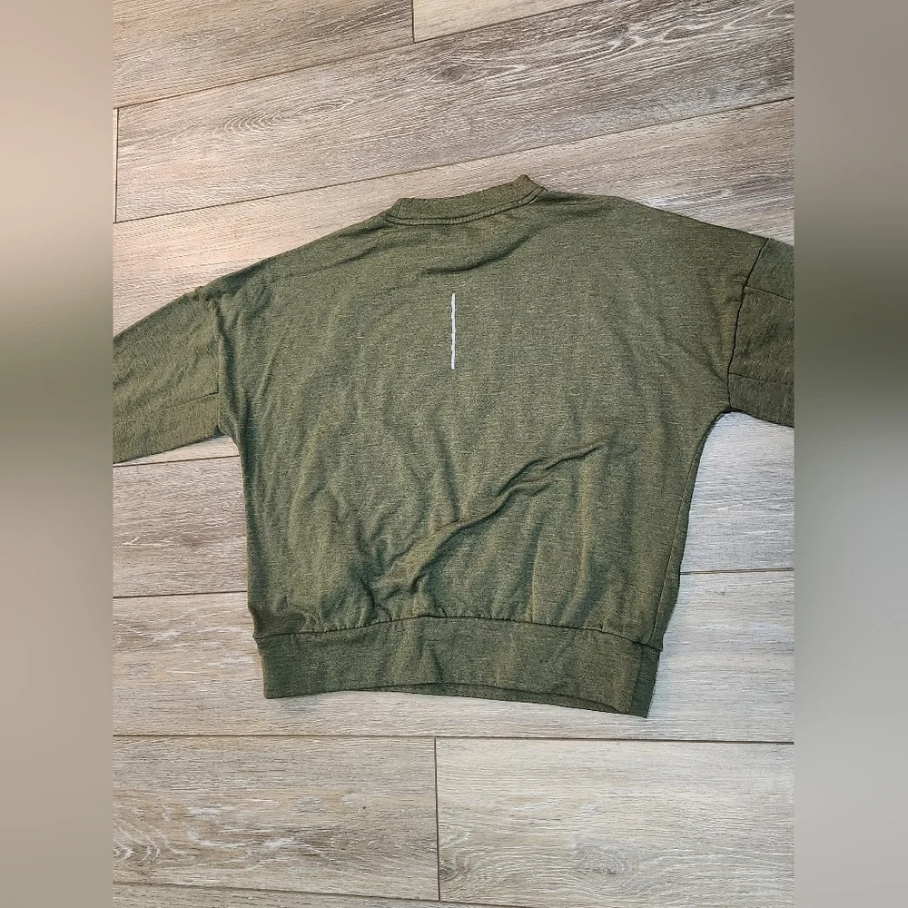 The Nike Running Women's Dri-Fit Crop Top Sweater in size Xsmall and olive green